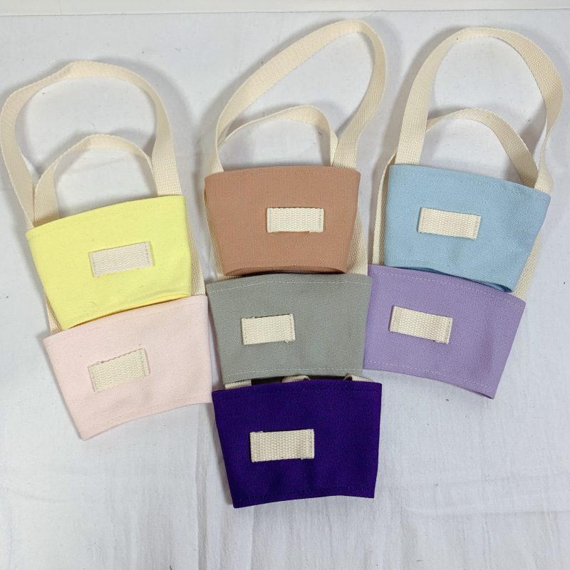 Fábrica al por mayor color sólido leche taza de té cubierta lona embalaje bebidas portátil bolso café taza mano