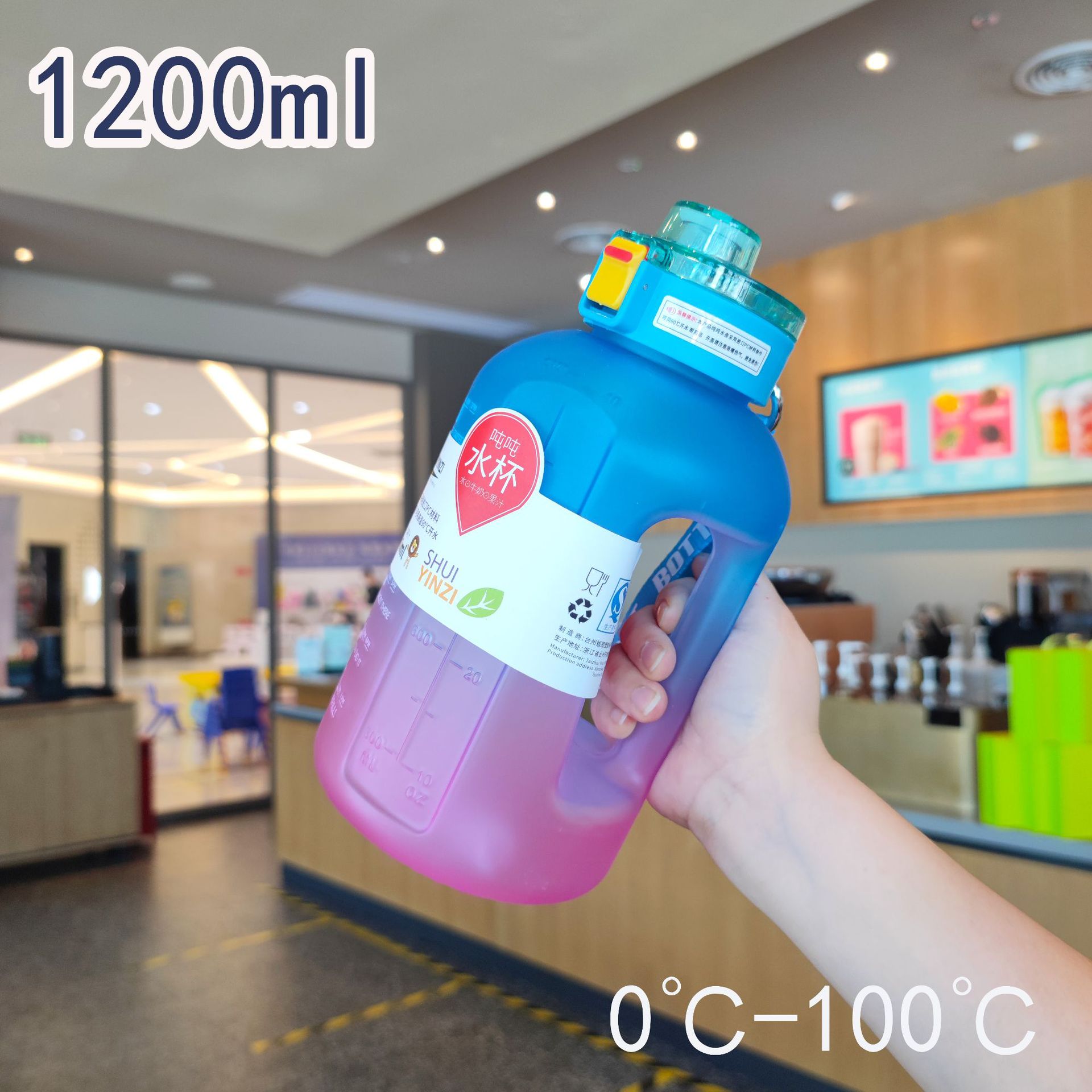 Botella de agua de plástico degradado de gran capacidad y alto valor con asa para fitness Botella de agua para deportes al aire libre 1200ml