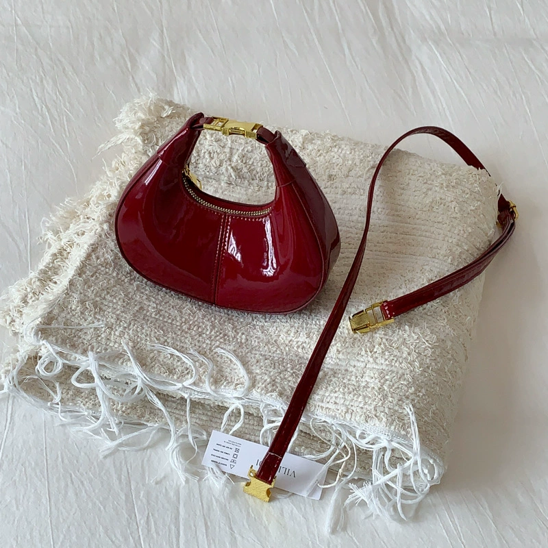 Высококачественная новая французская нишевая сумка в форме полумесяца, женская однотонная лакированная кожаная глянцевая женская сумка через плечо, сумка подмышки