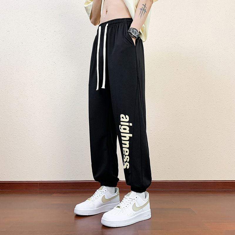 Pantalones cortos deportivos de hielo negro para hombres verano 2024 nueva marca de moda americana suelta rápida secado recto pantalones casuales de cinco puntos