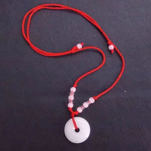 White protective amulet, small buckle