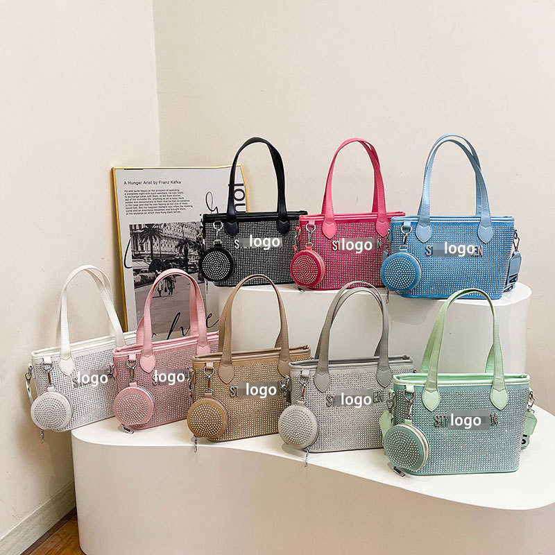 Bolso de letras de diamantes de imitación transfronterizos diseño de nicho femenino moda simple portátil popular 2025 nueva textura bolsa de mensajero