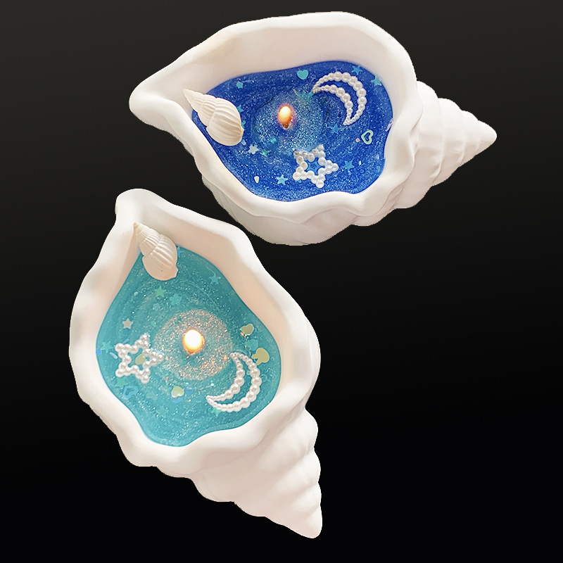 Doftljus formad som snäcka i presentförpackning för stämning_voghion.com