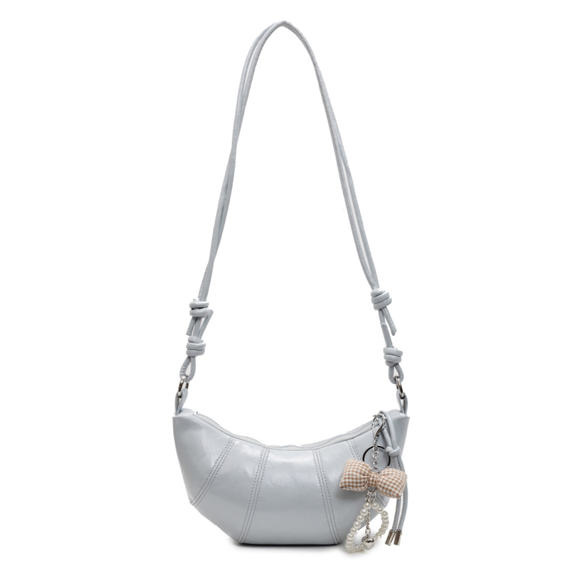 Bolso de todo fósforo de diseño de nicho para mujer 2025 nuevo bolso de cuerno de costura de color sólido bolso de axila de sentido avanzado de viaje casual