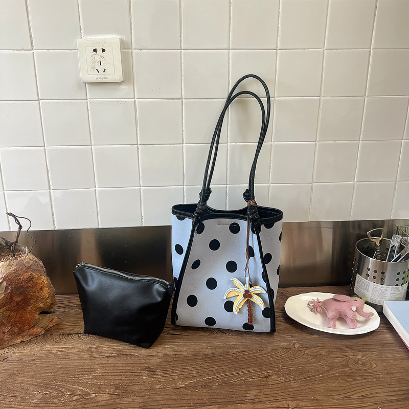 Bolsa de punto de onda de gran capacidad para mujeres 2026 verano nuevo ocio simple hombro brazo bolso de viaje al trabajo bolsa de mano