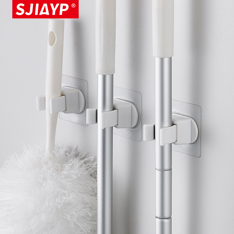 Cross-border best-selling Japanese plastic broom clip household bathroom no drilling wall-mounted magic broom storage rack hook