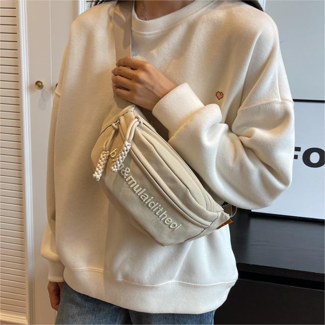 Bolso de pecho coreano de lienzo de letras mujeres 2025 nuevo bolso de hombro de estilo deportivo casual popular bolso de mochila de fuego universal