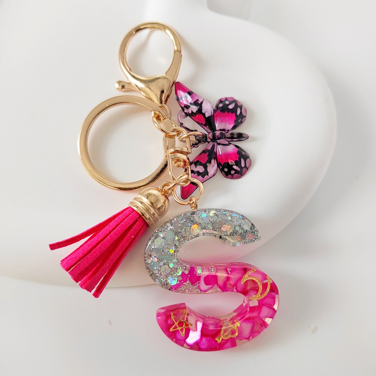 Inventario transfronterizo nueva resina bicolor mariposa borda llavero colgante estrella luna accesorios de joyas