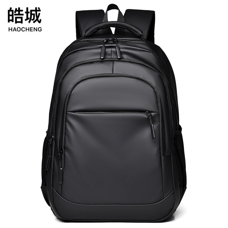 Comercio exterior al por mayor 2024 nueva mochila de película de cuero para hombres de negocios de gran capacidad 15,6 pulgadas mochila escolar para hombres