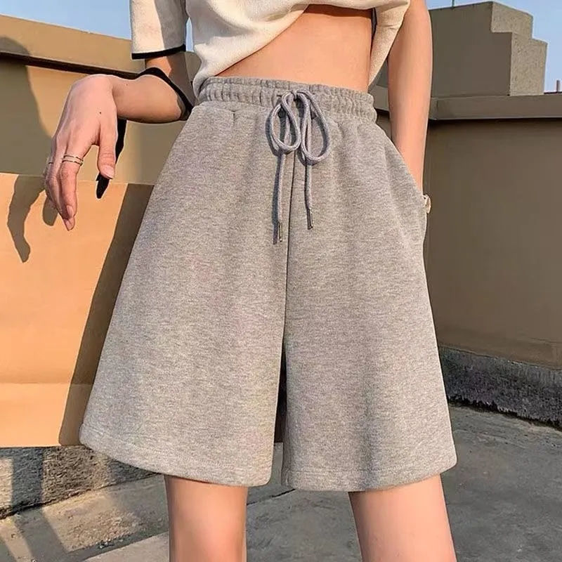 Pantalones cortos de cinco puntos de todo fósforo de color sólido pareja masculina marca de moda estilo delgado básico simple cintura elástica de verano adelgazante deportes y ocio