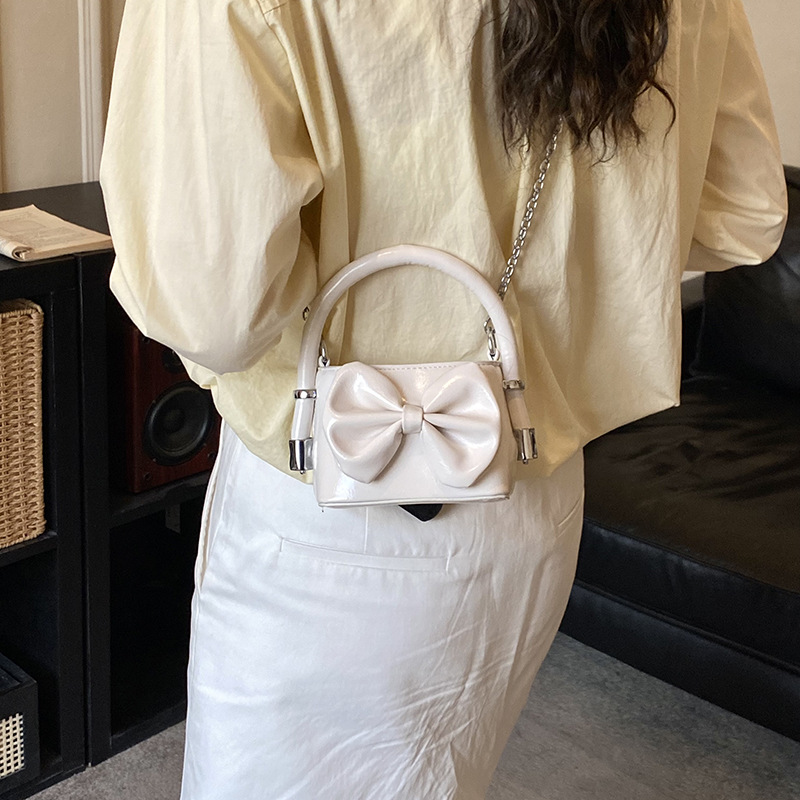 Nuevos bolsos de cadena coreanos para niños y niñas, bolsos de mini arco, bolsos de mano para niños, bolsos de comercio exterior transfronterizos