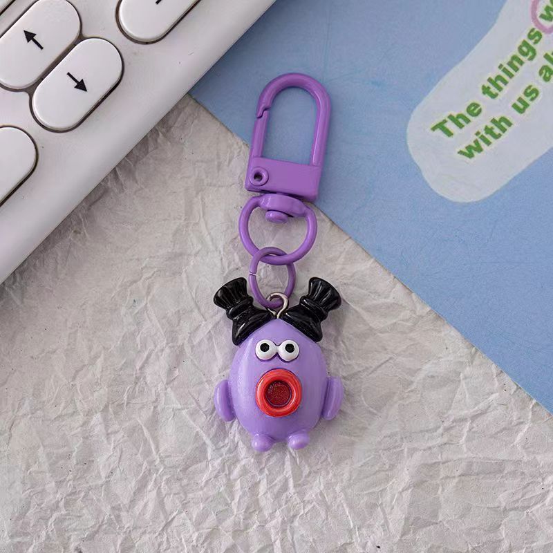 Bonita boca grande extraña llavero salchicha colgante estudiante pequeño libro rojo con accesorios colgante de color para amigos regalos