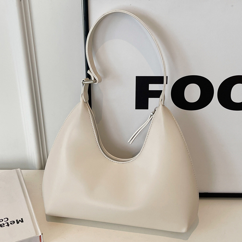 Axilas femininas 2024 novas em formato de crescente minimalista com temperamento versátil, viagens casuais, textura portátil,_voghion.com