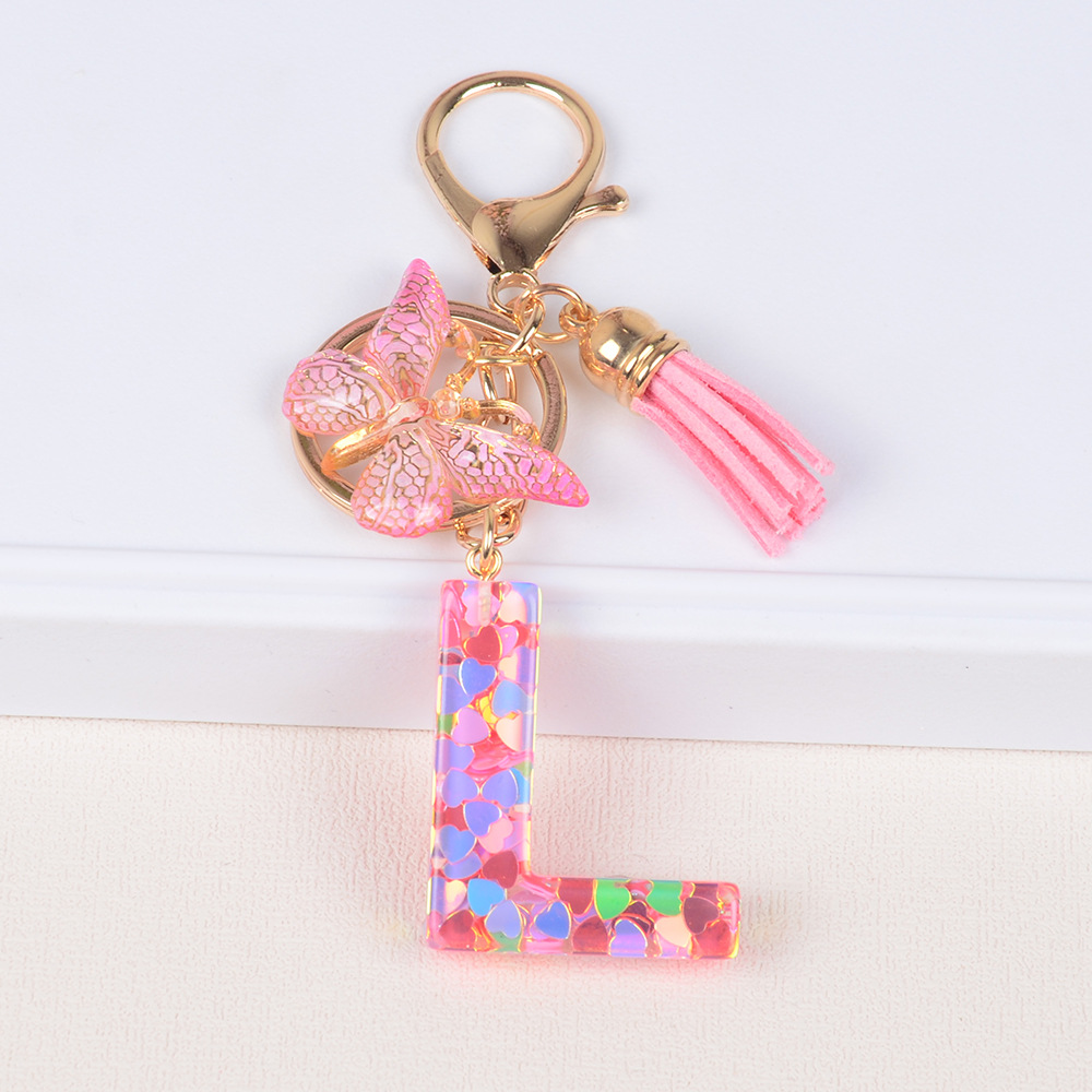 Explosiones transfronterizas amor sequillas iniciales llavero al por mayor resina letra mariposa fringe llavero se puede personalizar