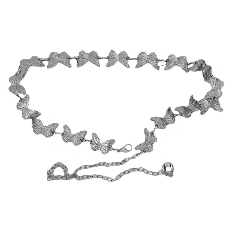 蝶の金属の腰のチェーンの女性は腰を収めてやせています。|undefined