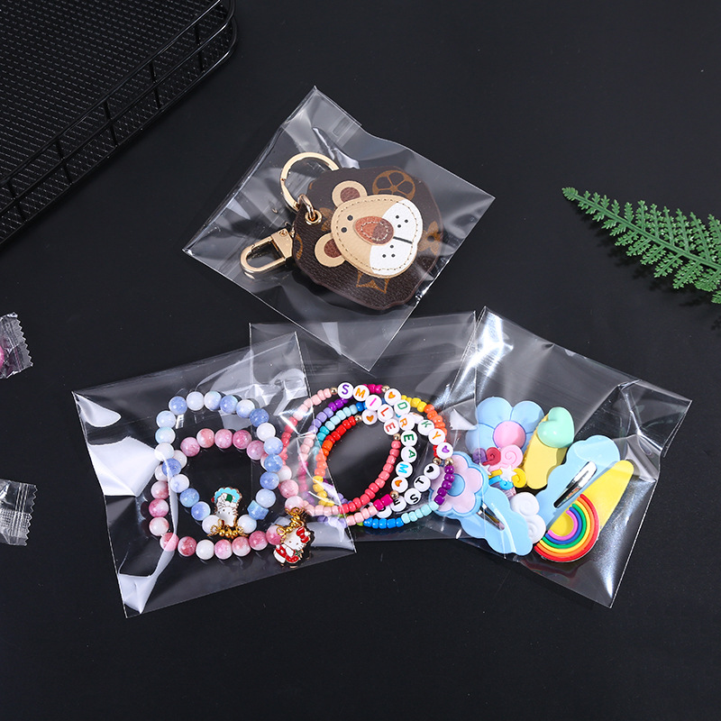 Bolsa de embalaje de ropa OPP al por mayor bolsa de embalaje de joyería bolsa de plástico transparente autoadhesiva bolsa de boca plana