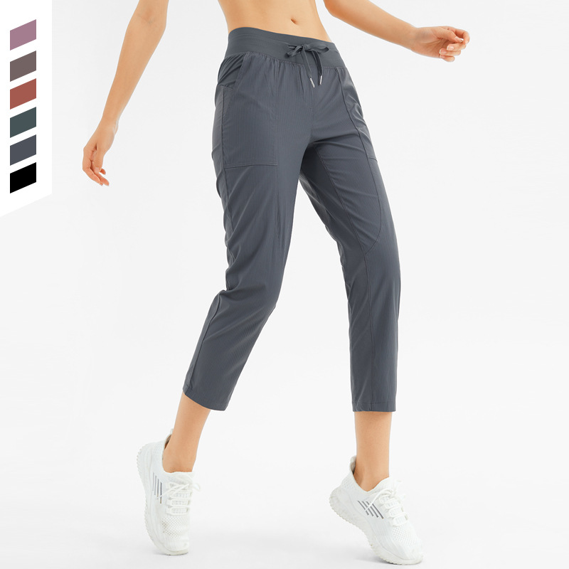 Pantalones deportivos delgados lulu pantalones de fitness de pies con cordón casuales sueltos para mujer correr pantalones de yoga de ocho puntos de secado rápido transpirables image 1