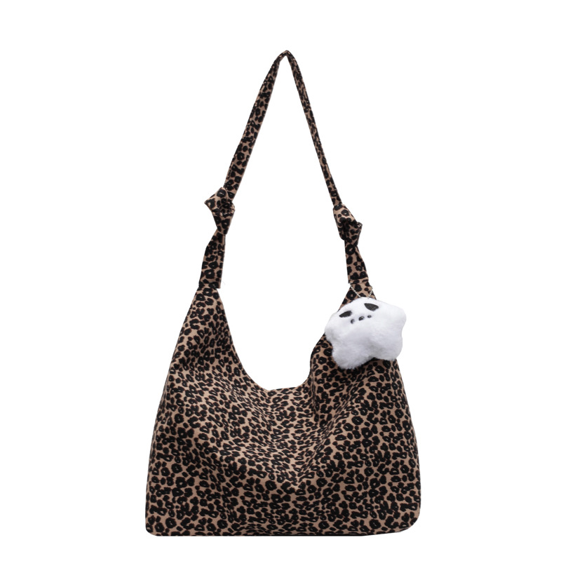 Estilo japonés y coreano estilo occidental de moda pequeño bolso de hombro con estampado de leopardo 2024 nuevo bolso de lona de gran capacidad bolso femenino de viaje al por mayor
