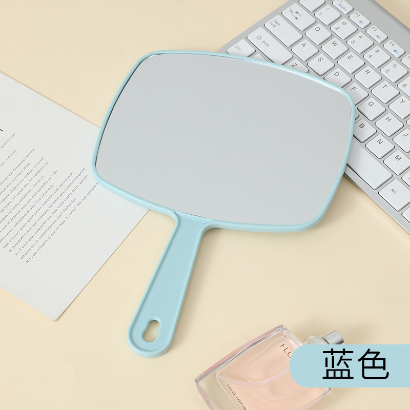 Espejo de maquillaje portátil de gran tamaño multifuncional colgante color sólido HD belleza mango espejo fábrica al por mayor