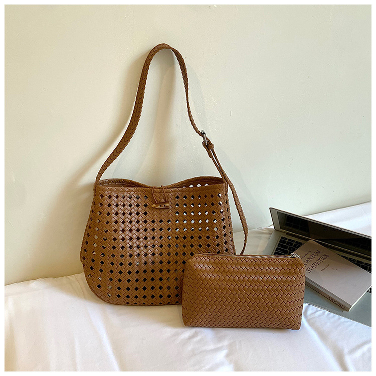 Bolsa de tejido hueco de gran capacidad para mujeres 2026 verano nuevo estilo coreano simple bolso de brazo de viaje bolsa de ocio