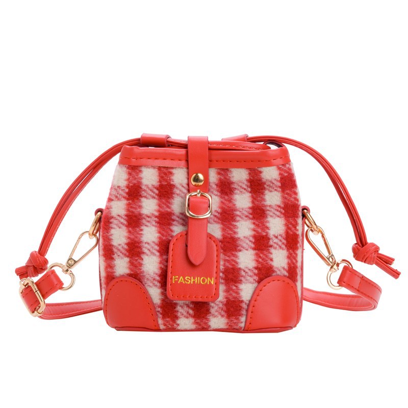 2025 nuevo bolso infantil de moda coreana estampado leopardo para niños y niñas bolso de cubo de aire a placas extranjeras bolso de cambio de bebé
