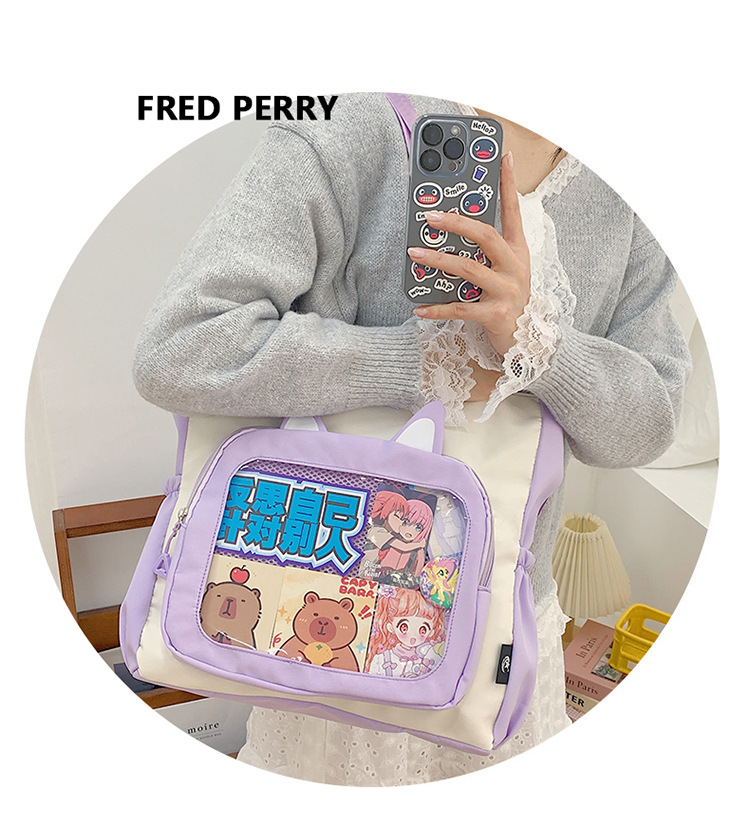 The new cute cartoon printed student bag with a large capacity and transparent student storage single-shoulder bag is selling well for women undefined