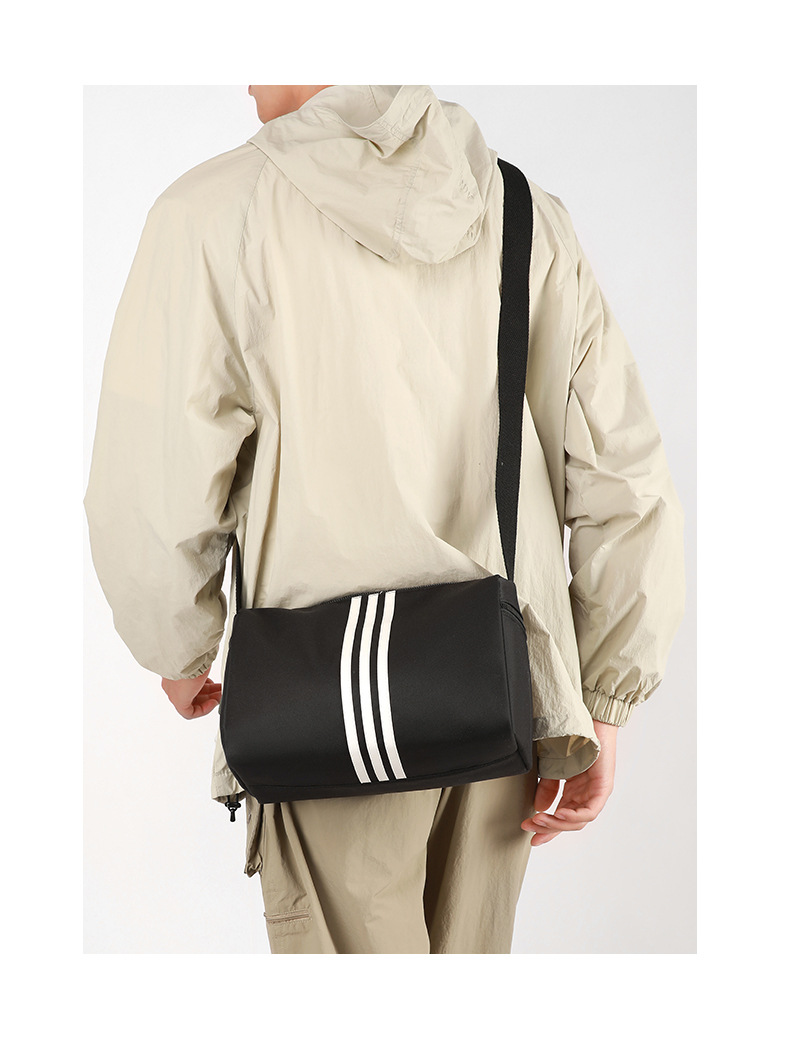 This is a simple, fashionable, casual and versatile crossbody bag for women, suitable for commuting. It is a large-capacity striped single-shoulder bag for both men and women undefined