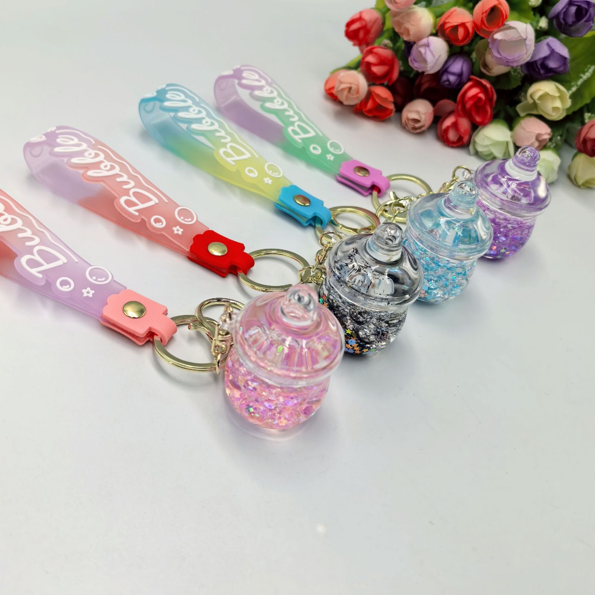 Nocturnal burbuja perlas de arena en aceite botellas de leche colgante llavero bolsos de moda boutique colgante regalo creativo