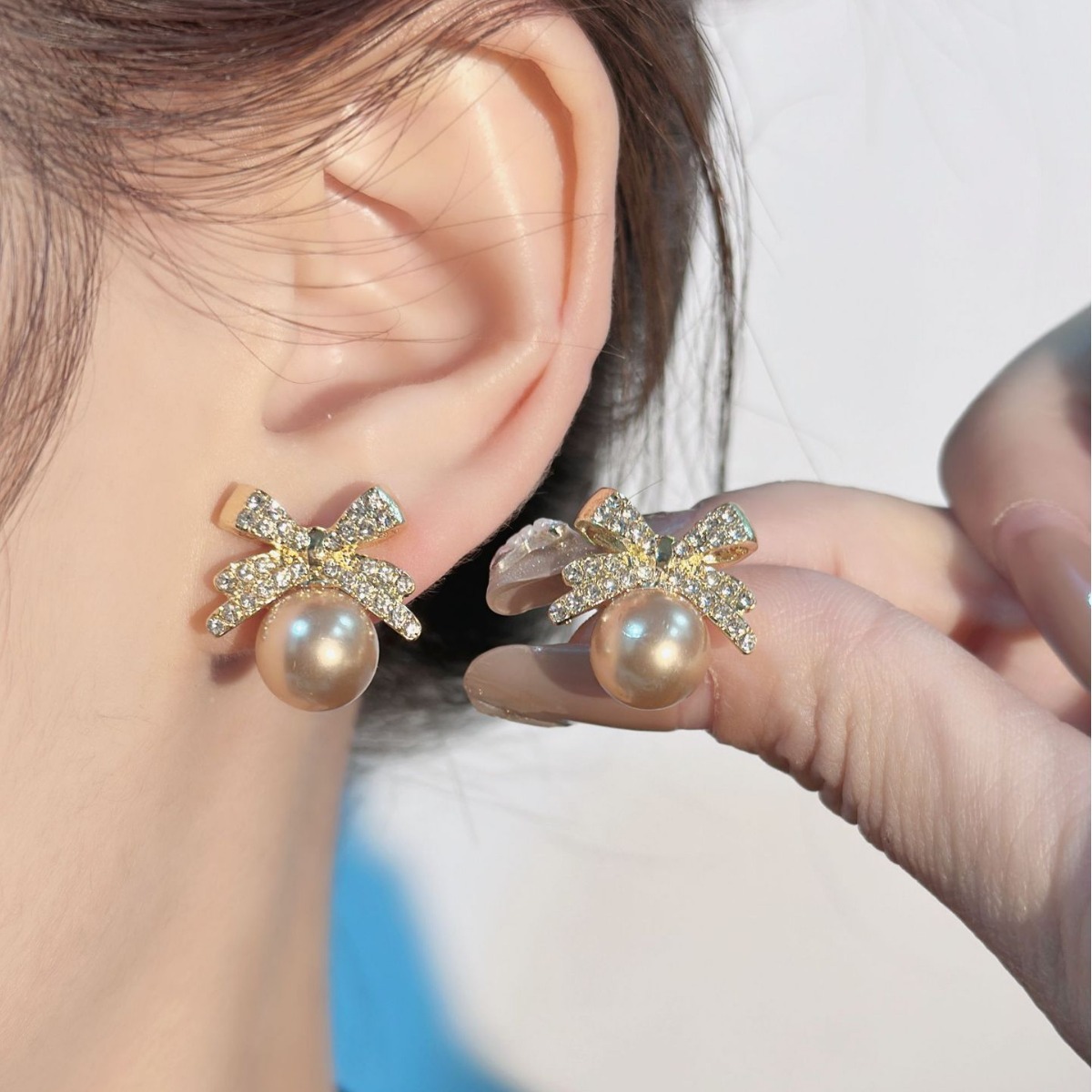Korean bow pearl studded diamond temperament, niche, light luxury, high-end design, earring earrings_voghion.com