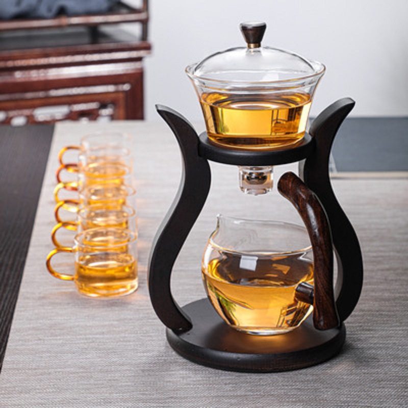 Fábrica al por mayor Palacio lámpara juego de té de vidrio borosilicato fabricante de té perezoso Kung Fu juego de té traje de succión magnética juego de té