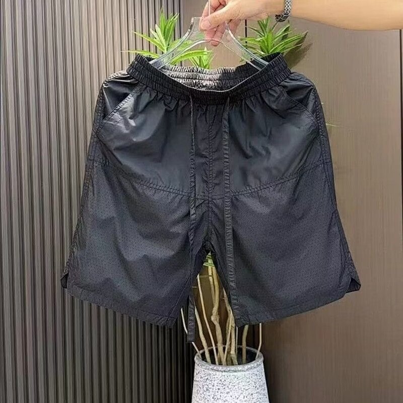 Pantalones cortos casuales de color sólido verano nuevo estilo delgado perforado transpirable pantalones de cinco puntos pantalones sueltos casuales de cinco puntos