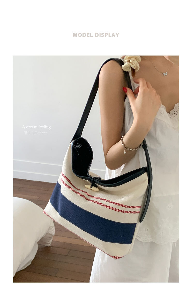 Korean version large-capacity women's 2025 new style fashionable canvas striped single-shoulder underarm bag casual commuting tote bag full figure