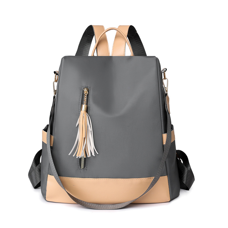 2024 nueva mochila de color de contraste moda simple mochila casual mujer cuero suave bolsa de viaje ligera de gran capacidad al por mayor