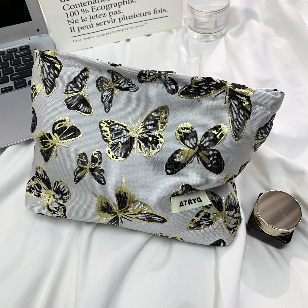 Bolsa de maquillaje de mariposa transfronteriza, bolsa de almacenamiento portátil para productos de cuidado de la piel, bolsa de lavado de viaje, bolsa cuadrada, bolsa de mano