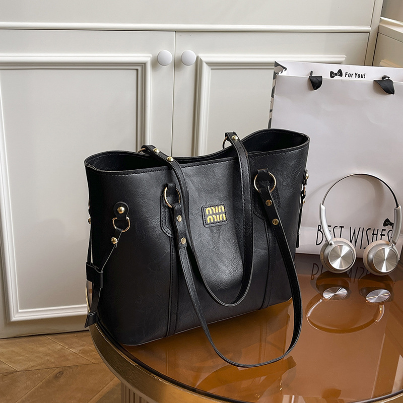 Texturas extranjeras bolsas de gran capacidad para mujeres otoño y invierno 2025, nuevas bolsas de hombro de moda, nicho, bolsas de viaje retro
