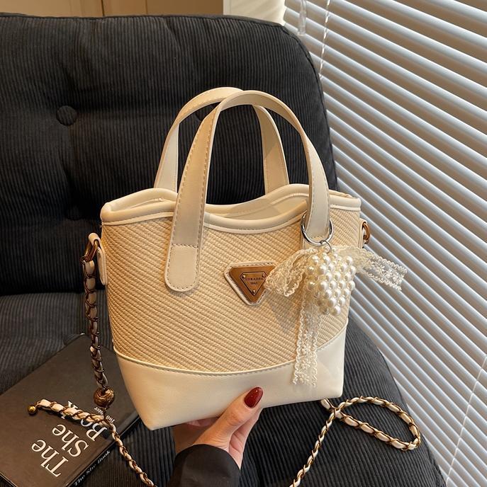 Bolso de mano de color de contraste popular de este año para mujer 2025 nuevo bolso de cubo más vendido bolso de mensajero casual de alta gama de todo fósforo