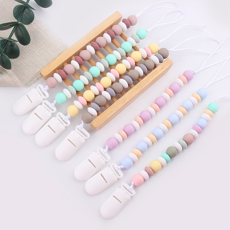 Nuevos productos para bebés cadena de tetas para calmar al bebé dibujos animados DIY color silicona mordida cadena de tetas cadena anti-caída cadena