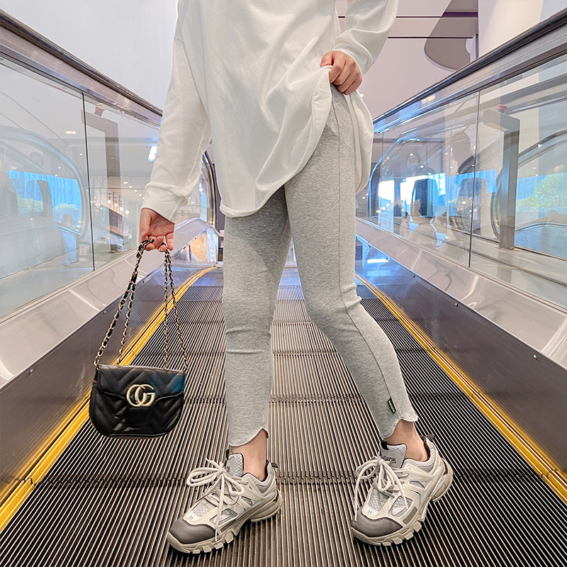 Polainas de las niñas de primavera y otoño nuevas niñas medias y grandes niños pantalones de todo fósforo ropa exterior de moda Pantalones de los niños de moda