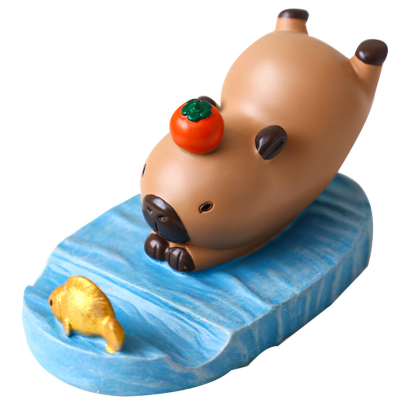 Dibujos animados linda celebridad de Internet Kapibala soporte para teléfono móvil decoración escritorio de oficina estación perezosa soporte plano artefacto