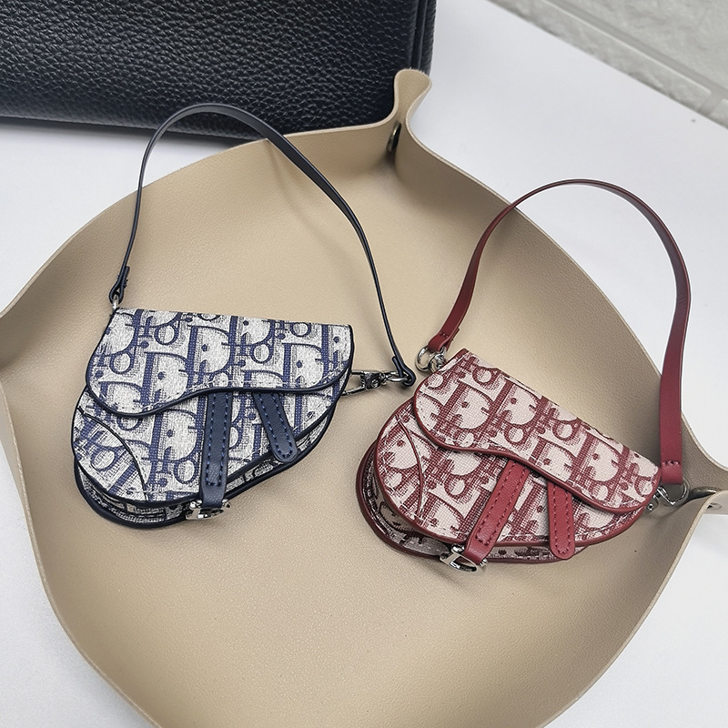 New D Brand Saddle Bag with Monogram, Mini Earphone Case, Car Keychain Pendant, Handbag Accessory, Coin Purse Blind Box New D Brand Saddle Bag with Monogram, Mini Earphone Case, Car Keychain Pendant, Handbag Accessory, Coin Purse Blind Box
