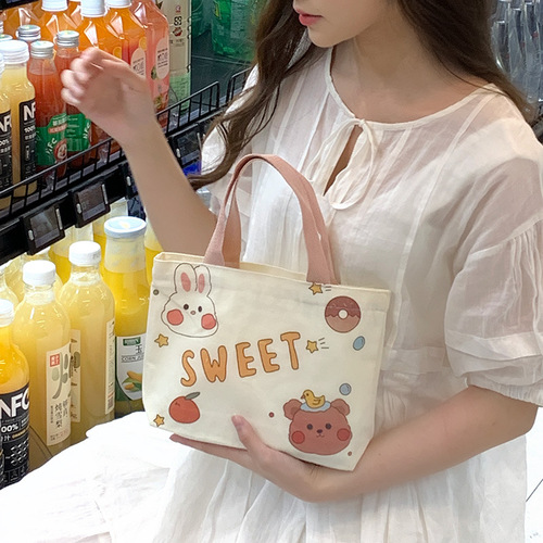 Canvas bag, women's hand-held lunch bag, cartoon bag, small hand-held bag, manufacturer wholesale, versatile, literary student bag