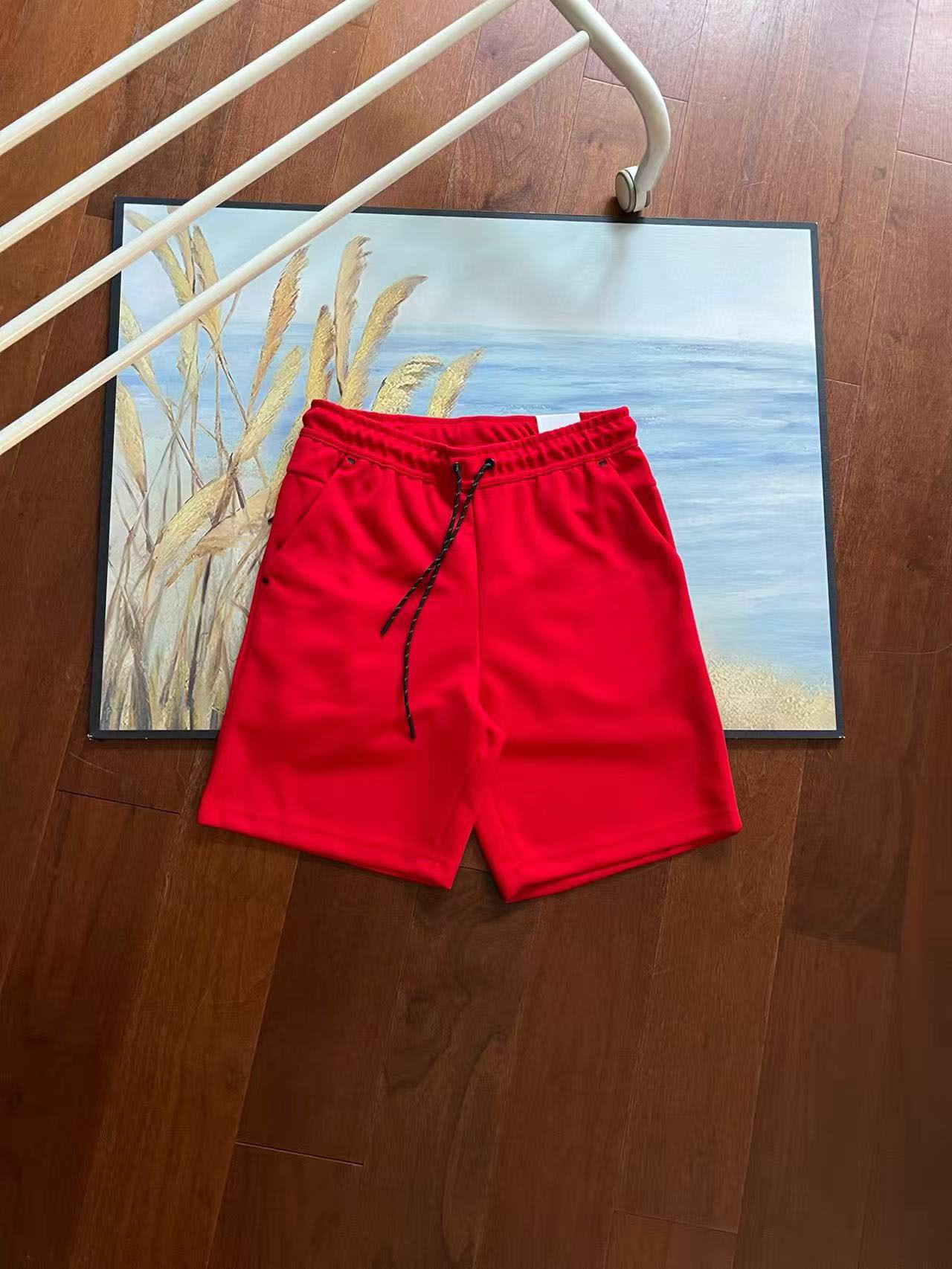 Verano nuevo estilo pequeño gancho versión en el extranjero de doce colores pantalones cortos deportivos de punto de pegamento lateral para hombres pantalones de cinco puntos 4503