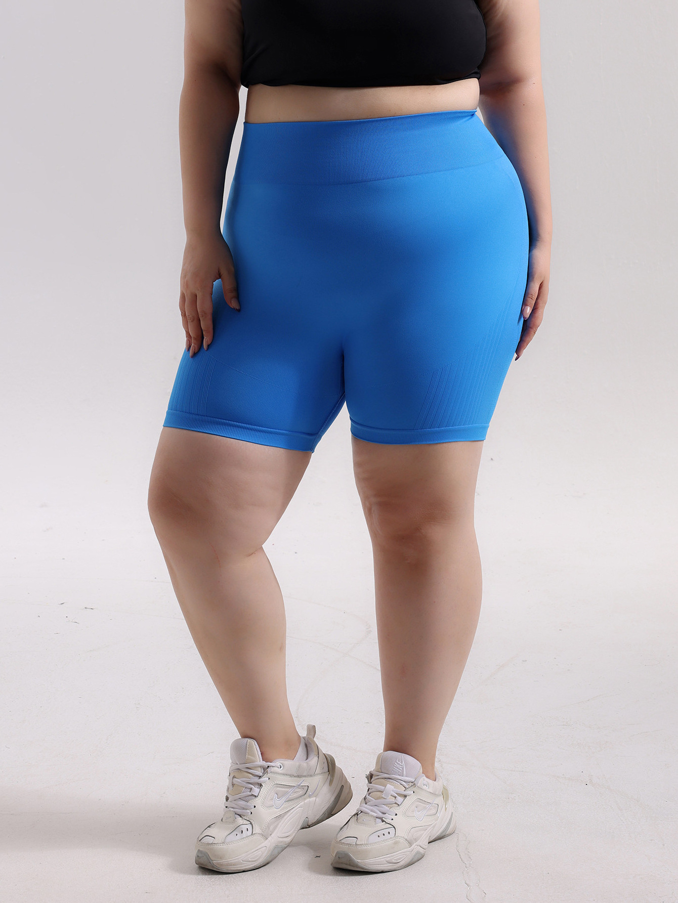 Pantalones cortos de cadera de melocotón deportivos sin costuras de gran tamaño europeos y americanos