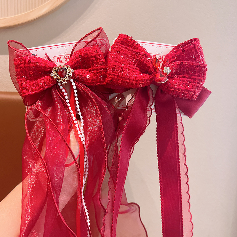 Children's red hairgrip with bow
