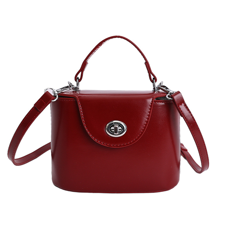 Nicho coreano caja de bloqueo de mano bolso pequeño para mujeres 2026 nueva moda exquisita versátil bolso de hombro