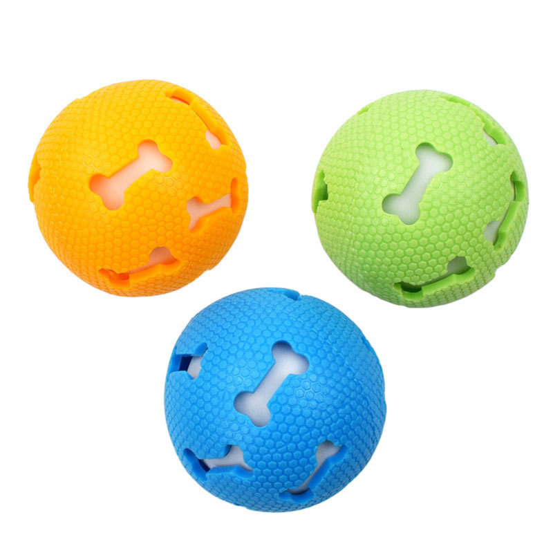 Transfronterizos perros juguetes elásticos hueso hueco bola luminosa 7,5 cm resistente a la mordida TPR fábrica de juguetes de mascotas al por mayor