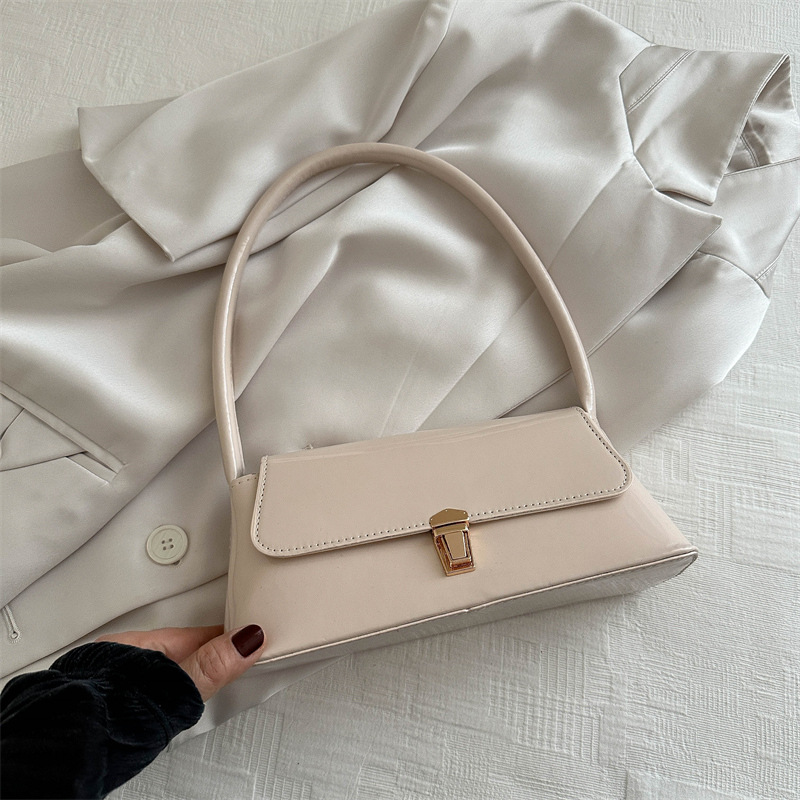 Temperamento simple bolso de hombro de bloqueo de color sólido para mujeres 2024 primavera y verano nuevo nicho de alta calidad bolso de brazo bolso de mujer