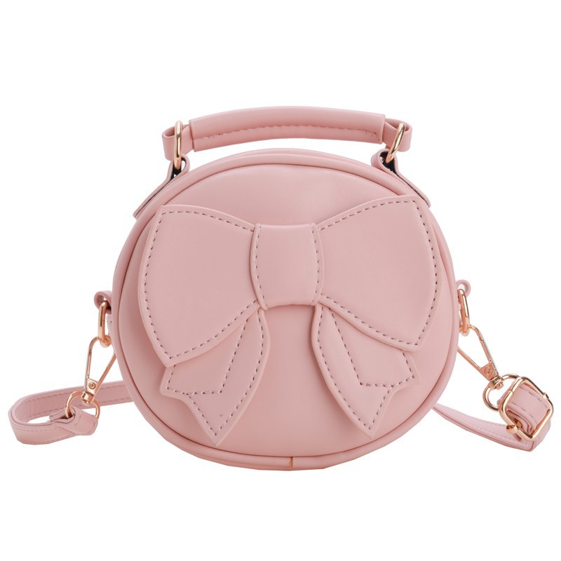 Bolsos para niños mini lindos arcos para hombres y mujeres, bolsos redondos para niños 2025 moda coreana nueva bolsa de cambio para niños