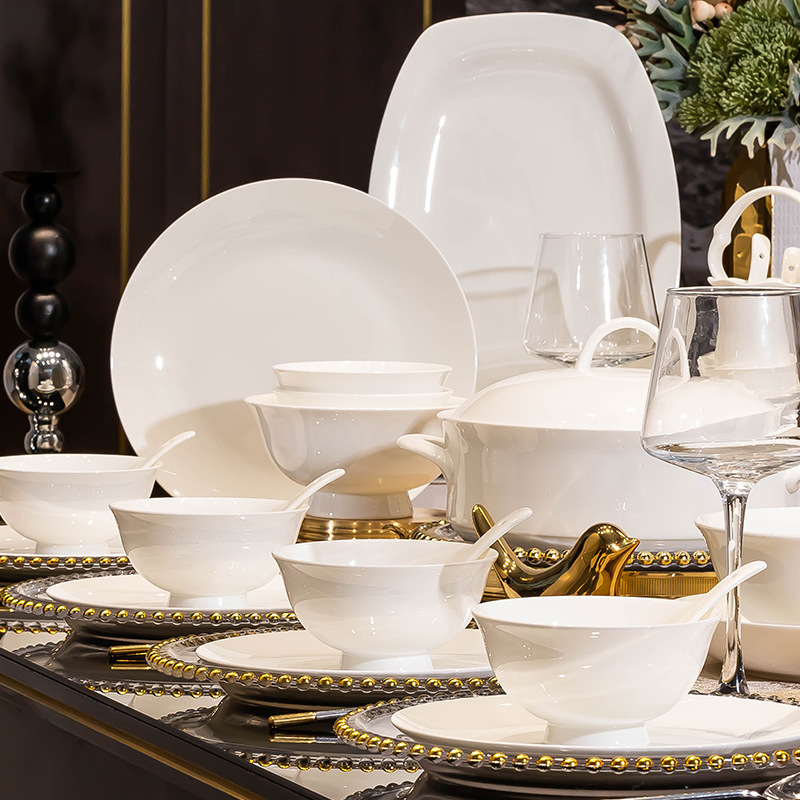 Pure white, minimalist, and luxurious dinnerware set – a perfect gift for housewarming or as a set of ceramic tableware for everyday use Pure white, minimalist, and luxurious dinnerware set – a perfect gift for housewarming or as a set of ceramic tableware for everyday use