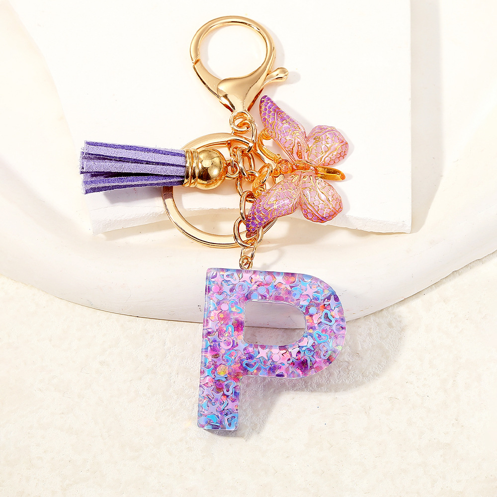 Mayorista transfronterizo mariposa esquinilla iniciales llavero de cristal goteo llavero de letras bolsos colgante